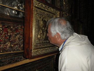 Bethlehem. Kissing the icon at the Greek Orthodox Altar.